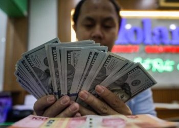 Rupiah Bergerak Fluktuatif Terhadap Dolar AS di Tengah Sentimen Global